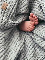 Baby wrapped in soft cotton towel